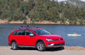 2017 VW Golf Alltrack on the road in red