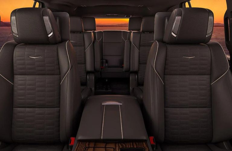 Front view of the three-row seating arrangement of the 2023 Cadillac Escalade with second-row captain's chairs