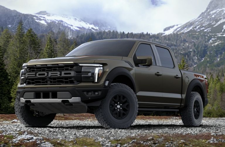 Shelter Green 2024 Ford F-150 Raptor in the Mountains