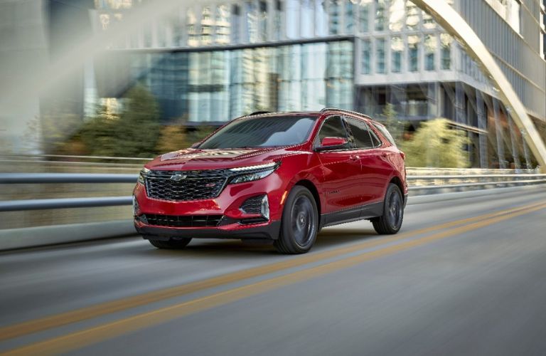 Red 2024 Chevy Equinox RS on City Street